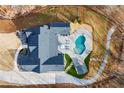 Aerial view of a luxury backyard with an in-ground pool and hot tub at 8710 Little Mill Rd, Cumming, GA 30041