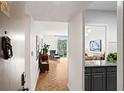 Apartment hallway leading into a living space with hardwood floors and modern finishes at 130 26Th Nw St # 511, Atlanta, GA 30309