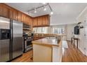 Well-equipped kitchen with wood cabinets, stainless steel appliances, and hardwood floors at 2232 Dunseath Nw Ave # 302, Atlanta, GA 30318