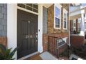 Close-up of the front door with the house number, showcasing the brick facade and iron railing at 2316 Limehurst Ne Dr, Atlanta, GA 30319
