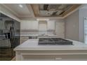 Close-up of the island cooktop and stainless steel appliances in the kitchen at 4570 Thicket Trl, Snellville, GA 30039