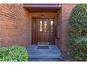 Inviting front entrance with a decorative glass door and brick surround at 2 Westchester Sq, Decatur, GA 30030