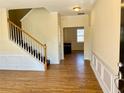 Inviting entryway with wood floors and staircase leading to the upper level at 1399 Dukes Creek Nw Dr, Kennesaw, GA 30152