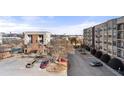 Apartment complex featuring a parking lot and trees at 898 Oak Sw St # 1306, Atlanta, GA 30310