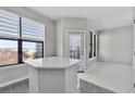 Bright kitchen featuring large windows with blind shades and light countertop seating area at 898 Oak Sw St # 1306, Atlanta, GA 30310
