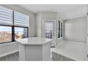Bright living space featuring large windows, a balcony, and an adjacent seating area at 898 Oak Sw St # 1306, Atlanta, GA 30310