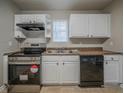 Bright kitchen featuring stainless steel oven, dishwasher, double sink and plenty of counter space at 6112 Shadow Rock Ln, Lithonia, GA 30058