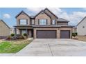 Inviting two-story home with brick facade, two-car garage, and landscaped front yard at 1160 Faulkner Way, Jonesboro, GA 30238