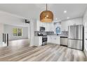 Modern kitchen with stainless steel appliances, white cabinetry, and ample counter space at 2954 Lighthouse Ct, Acworth, GA 30101