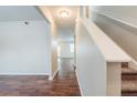 Bright entryway with hardwood floors and a staircase leading to the upper level at 450 Lake Ridge Ln, Fairburn, GA 30213