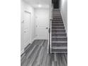 Bright hallway with stairs, leading to the upper levels of the home at 2008 Main Nw St, Atlanta, GA 30318