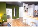 Stylish living space with wood-look floors and an open-concept design flowing into the kitchen and dining areas at 898 Oak Sw St # 1410, Atlanta, GA 30310