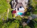 Overhead view of backyard featuring a pool with a stone waterfall feature and landscaping at 2660 Portabella Ln, Cumming, GA 30041