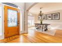 Inviting home foyer with hardwood floors, and a beautiful entry door with glass at 2660 Portabella Ln, Cumming, GA 30041