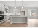 A modern kitchen with a large island, stainless steel appliances, and bright, airy atmosphere at 408 Vinca Nw Cir, Kennesaw, GA 30144