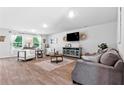 Spacious living room with wood floors, modern furniture and decor at 651 Egrets Landing #53, Covington, GA 30014