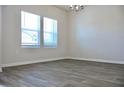 Bright, open dining room with stylish chandelier and large windows at 642 Egrets Landing #66, Covington, GA 30014