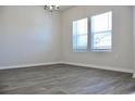 A spacious living room with hardwood floors, natural light, and neutral paint at 642 Egrets Landing #66, Covington, GA 30014