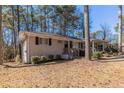 Charming brick home with a covered carport, showcasing a neatly landscaped front yard at 2777 Luther Dr, Atlanta, GA 30344