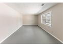 Empty living room with plenty of natural light from the window at 3884 Rockey Valley Dr, Conley, GA 30288