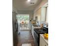 Well-lit kitchen with stainless steel appliances and a view of the backyard at 5824 Par Four Ct # 5824, Lithonia, GA 30038