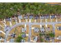 Aerial view of a residential neighborhood street lined with mature trees and well-kept lawns at 11853 Harbour Town Pkwy, Fayetteville, GA 30215