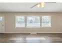 Bright living room with hardwood floors, large windows offering natural light at 1925 Campbellton Sw Rd, Atlanta, GA 30311
