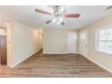 Open-concept living room showcasing laminate floors and a view of the kitchen at 3192 Belfort Se Rd, Atlanta, GA 30354