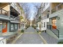 Townhome backyard view showing colorful facades with central walkway, offering a private outdoor space at 754 Aerial Way, Atlanta, GA 30312