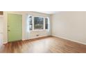 Bright and airy living room has gleaming hardwood floors and large windows at 2153 Powers Ferry Drive, Marietta, GA 30067