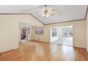 Spacious open-concept living area with vaulted ceilings, ceiling fan and hardwood flooring at 2153 Powers Ferry Drive, Marietta, GA 30067