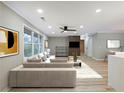 Bright living room boasts hardwood floors, a ceiling fan, and neutral-toned furniture at 2308 Mark Trl, Decatur, GA 30032