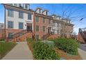 Beautiful brick and siding townhome with manicured landscaping and easy sidewalk access at 511 Burton Dr # 805, Alpharetta, GA 30009