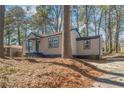 Angled view of charming home featuring updated siding, a welcoming front porch, and cozy curb appeal at 578 Center Hill Nw Ave, Atlanta, GA 30318
