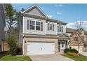 Charming two-story home with a brick and siding exterior and a two-car garage at 103 Bryon Ln, Acworth, GA 30102