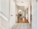 Bright and airy foyer with tiled flooring flowing into a spacious living area featuring a fireplace at 2000 Variations Dr, Atlanta, GA 30329