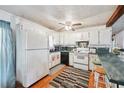 A kitchen featuring white cabinetry, and a breakfast bar with seating for casual dining at 1095 Dallas Nebo Rd, Dallas, GA 30157