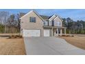 Charming new two-story home featuring a three-car garage, gray brick and siding, and a well-manicured lawn at 112 Felicity Pike, Locust Grove, GA 30248