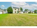 Spacious front yard showing the home's well-maintained lawn and proximity to neighboring houses at 5484 Denny Dr, Atlanta, GA 30349