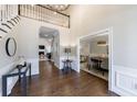 Beautiful foyer with hardwood floors, an elegant chandelier, and views into the living and dining areas at 630 Denards Se Ml, Marietta, GA 30067