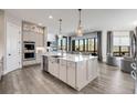 Spacious kitchen featuring a large island, stainless steel appliances, and modern cabinetry at 13425 Bishops Ct, Roswell, GA 30075