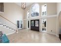 Grand foyer with soaring ceilings, tile flooring, and arched doorways at 1850 Kirkmont Nw Dr, Marietta, GA 30064