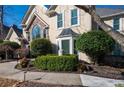 Beautifully landscaped front yard with lush greenery and a welcoming walkway at 1850 Kirkmont Nw Dr, Marietta, GA 30064