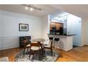 Cozy dining area with glass table, seating for four, and breakfast bar area at 955 Juniper Ne St # 4229, Atlanta, GA 30309