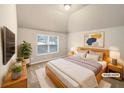 Comfortable bedroom featuring a large window and neutral decor at 2100 Trinity Mill Dr, Dacula, GA 30019