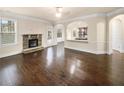Bright living room with hardwood floors and an open floor plan at 2100 Trinity Mill Dr, Dacula, GA 30019