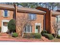 All-brick townhome with shutters and landscaping in a serene residential neighborhood at 3454 Ashwood Ln, Atlanta, GA 30341