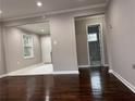 Open-concept living room featuring hardwood flooring and views into the kitchen and bathroom at 197 Upshaw Sw St, Atlanta, GA 30315