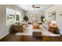 Bright and airy living room with hardwood floors, neutral paint, and abundant natural light at 6296 Flamingo Way, Morrow, GA 30260