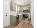 Modern kitchen features stainless steel appliances and sleek countertops at 594 Waynes Se Ct, Atlanta, GA 30354